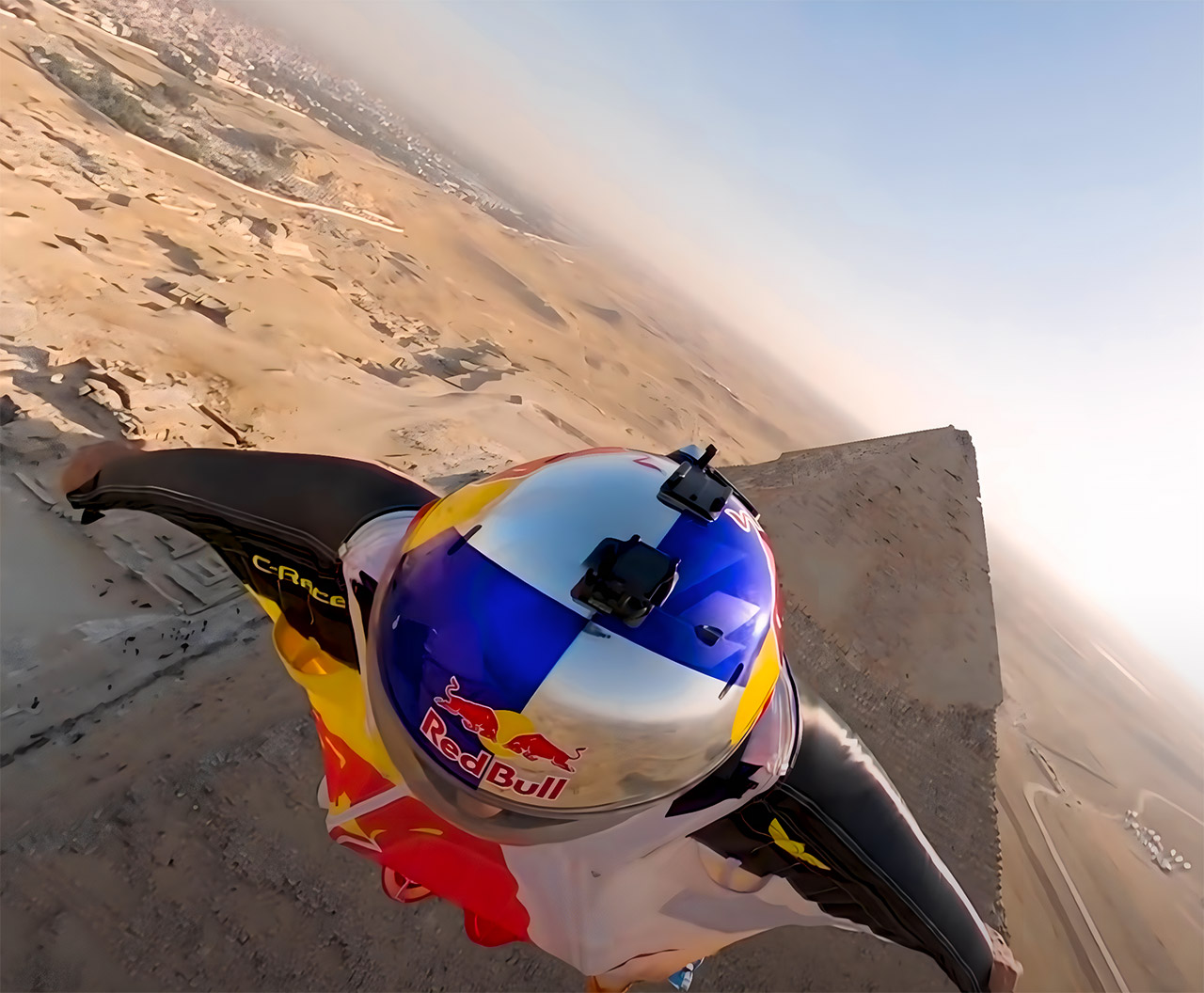 Wingsuit Pilots with GoProEquipped Helmets Capture Insane Pyramids of